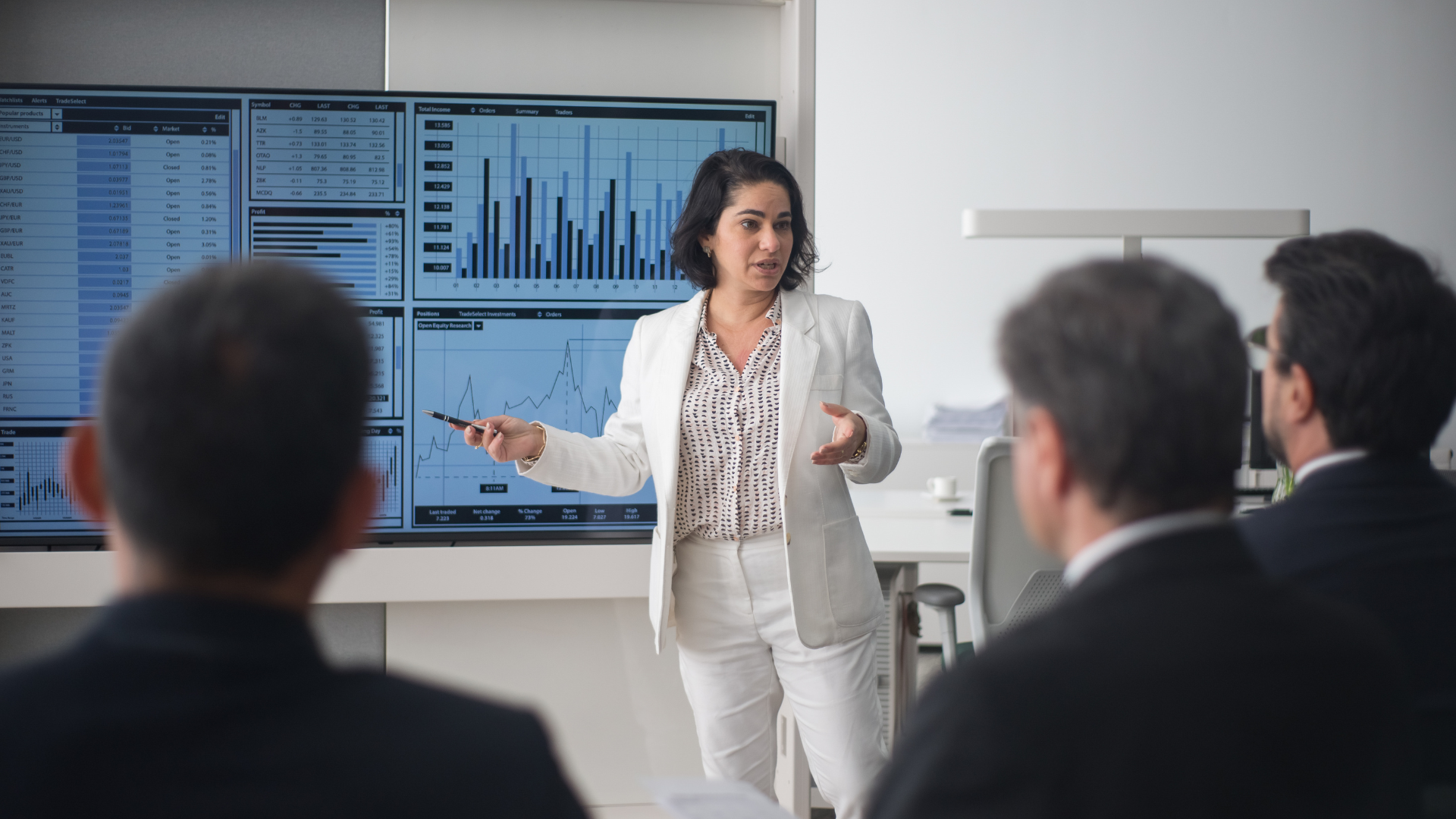 Presenter showing data to investors to turn investor interest into an FDI project