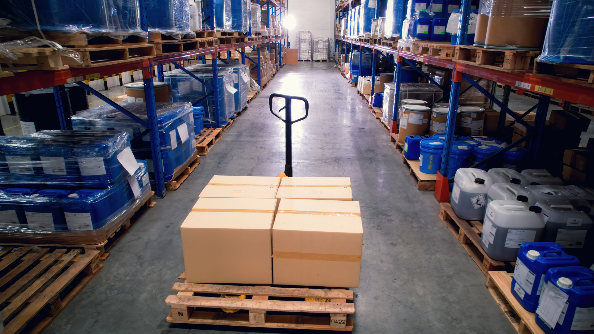 Warehouse with palletised stock, part of the local operations behind an entry model