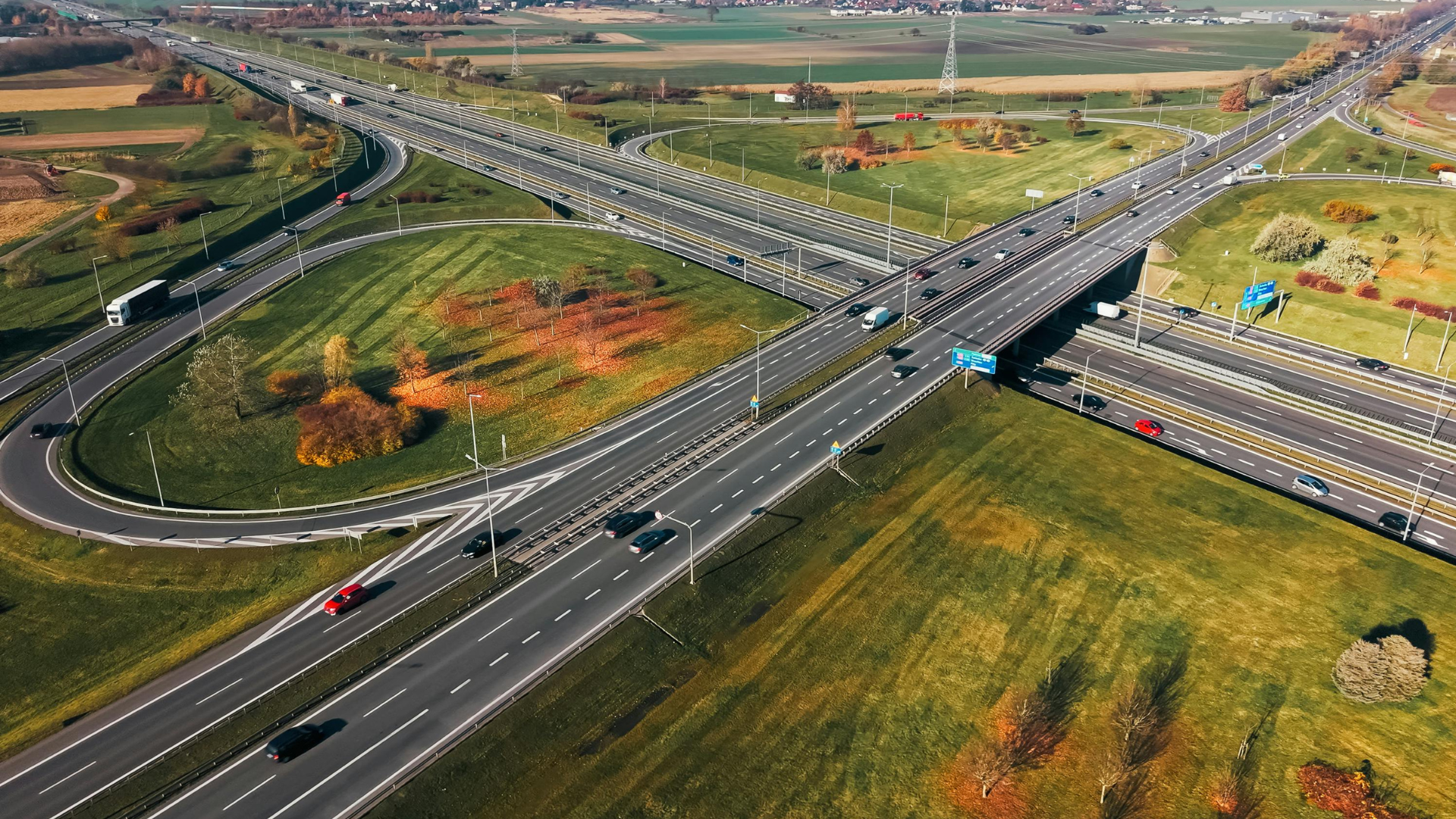 Aerial view of a motorway interchange, the kind of transport infrastructure investors assess in FDI projects